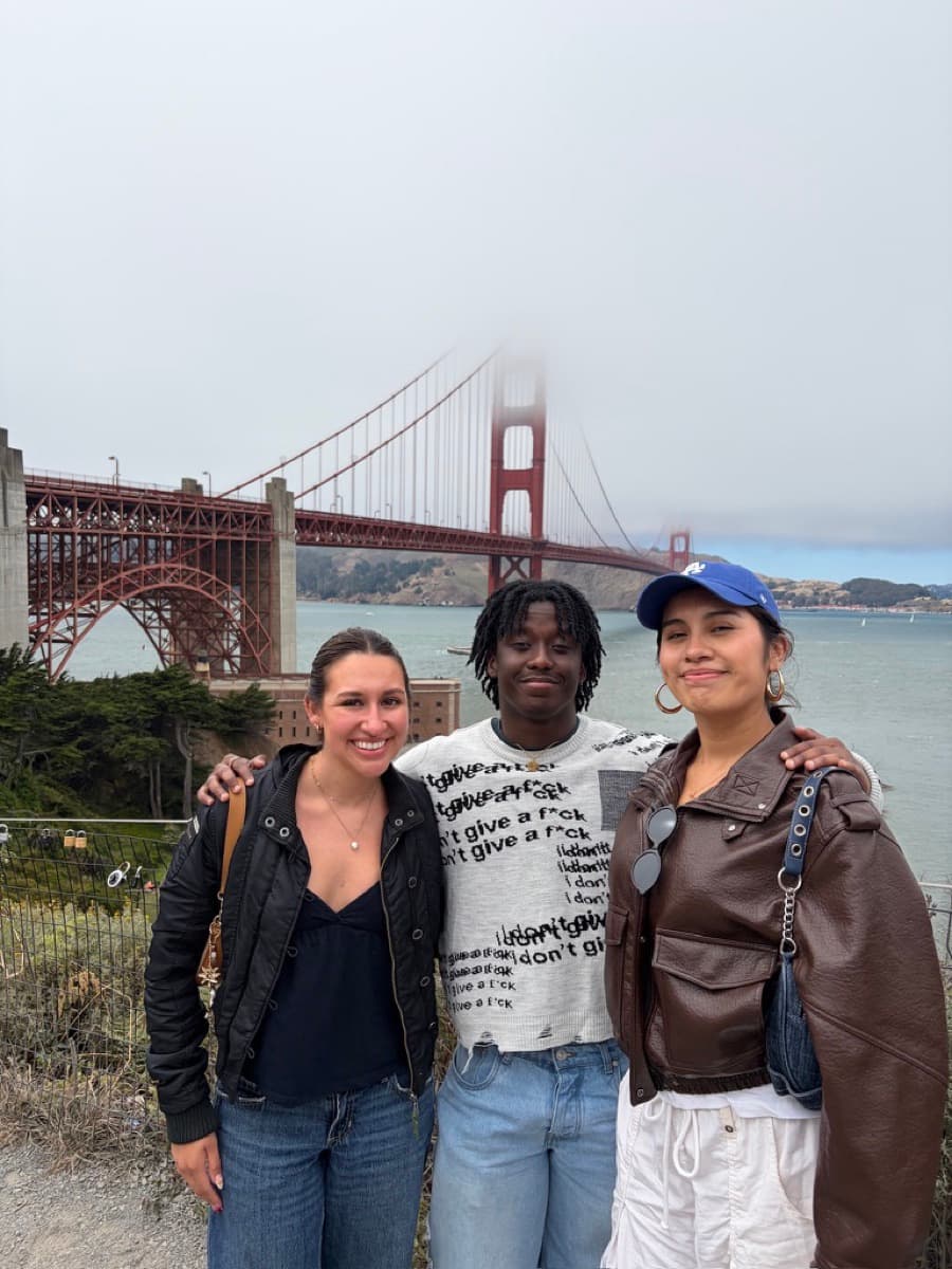 With friends in front of the Golden Gate Bridge on a foggy day